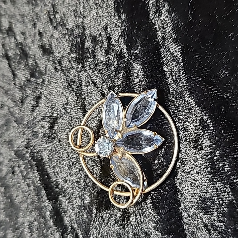Goldtone with baby blue Rinestone Brooche